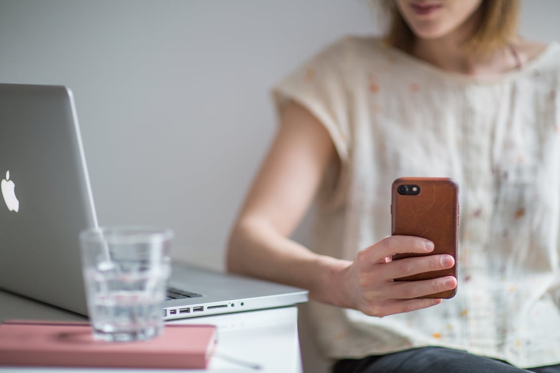 Photo of Woman Holding Smartphone